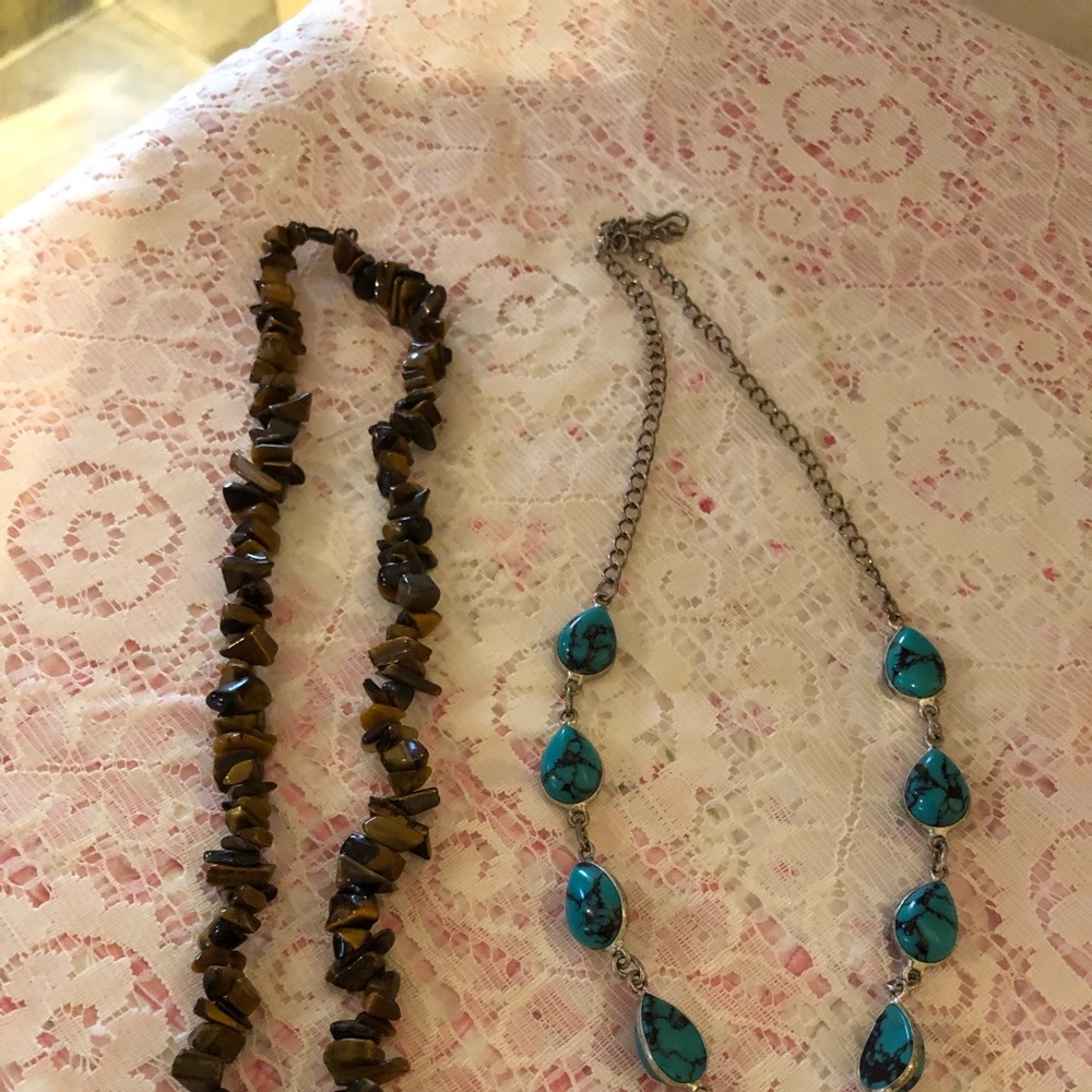 Two. Necklace sold in s bundle or individually.
